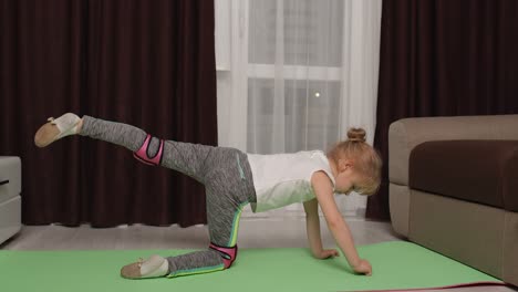 Child-kid-training-gymnastics-stretching-at-home,-children-girl-making-sport-workout-exercises