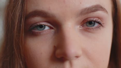 Close-up-macro-portrait-of-beauty-young-beautiful-woman's-eyes,-smiling-model-looking-at-camera