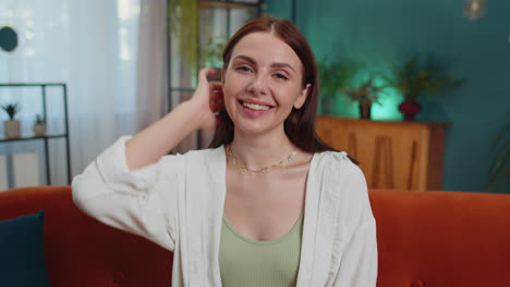 Close-up-portrait-of-happy-smiling-caucasian-woman-in-shirt,-looking-at-camera,-celebrate-good-news