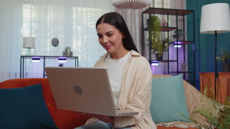 Amazed-young-woman-use-laptop-computer,-receive-good-news-message,-shocked-by-victory,-celebrate-win