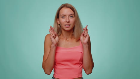 Stylish-woman-in-crop-top-shouting,-raising-fists-in-gesture-I-did-it,-celebrating-success,-winning