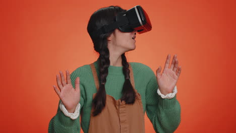 Young-woman-using-virtual-reality-headset-helmet-to-play-simulation-game-app,-watching-video-content