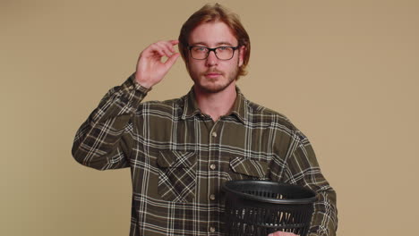 Smiling-man-taking-off,-throwing-out-glasses-into-bin-after-vision-laser-treatment-therapy