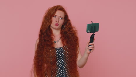 Girl-blogger-take-selfie-on-mobile-phone-selfie-stick-communicate-video-call-online-with-subscribers