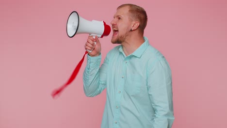 Smiling-bearded-man-talking-with-megaphone,-proclaiming-news,-loudly-announcing-sale-advertisement