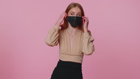 Young-smiling-woman-happily-taking-off-medical-mask-and-throws-it-away-celebrating-Coronavirus-end