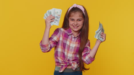 Successful-rich-child-girl-kid-holding-money-cash-dancing-listening-music-lottery-game-win-income