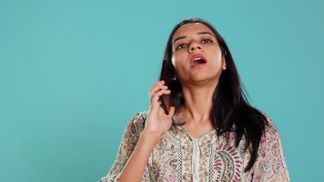 Woman-discussing-with-friend-over-telephone-call