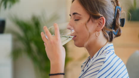 Smiling-Woman-Drinking-Water