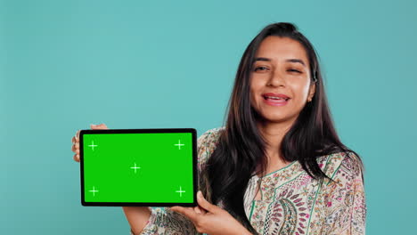 Energetic-salesman-doing-influencer-marketing-using-green-screen-tablet