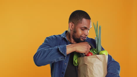 Male-person-using-scanner-at-local-farmers-market-checkout-counter