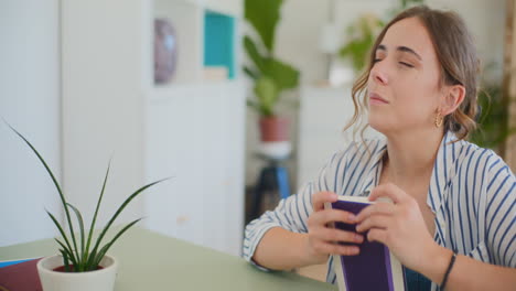 Reflective-Female-Student-Studying-at-Desk