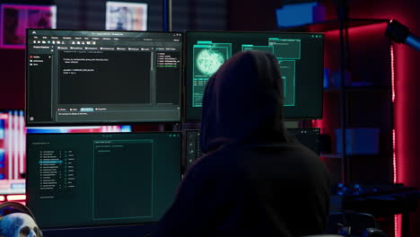 Experienced-hacker-writing-lines-of-code-on-computer-from-underground-bunker