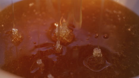 Pouring-Thick-Organic-Honey-into-Jar