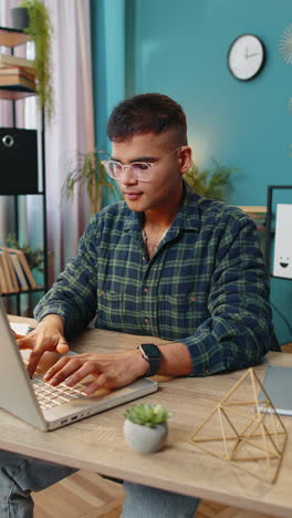 Man-smiling-friendly-at-camera-waving-hands-gesturing-hello-hi-greetings-online-video-call-at-home