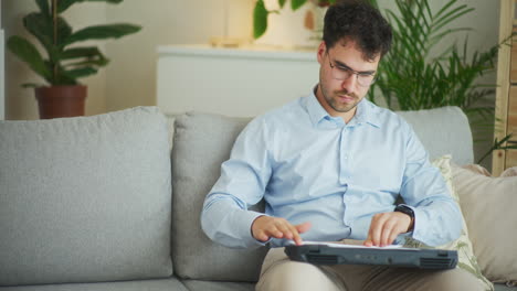 Businessman-Folds-Paper-Airplane-from-Boredom