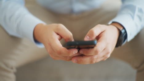 Man-Writes-Message-on-Smartphone-Close-Shot