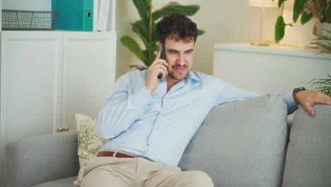 Happy-Businessman-Negotiates-on-Phone