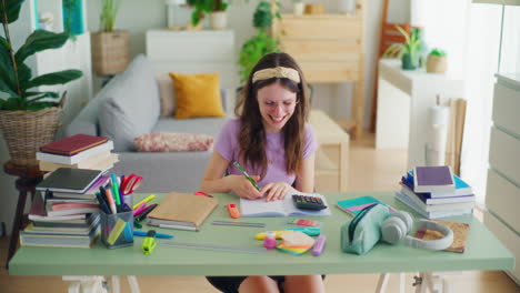 A-Young-Student-Uses-a-Calculator-While-Doing-Math-Homework