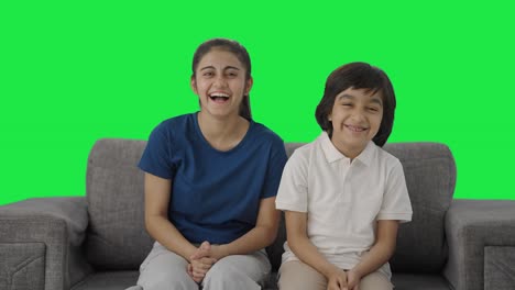 Happy-Indian-sibling-laughing-to-the-camera-Green-screen