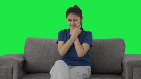 Sick-Indian-teenage-girl-having-a-tooth-ache-Green-screen