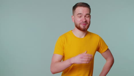 Cheerful-lovely-bearded-adult-man-fashion-model-in-casual-t-shirt-smiling-and-looking-at-camera