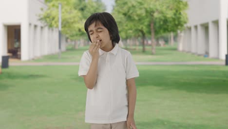 Sick-Indian-boy-suffering-from-cold-and-cough-in-park