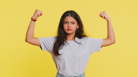 Woman-looking-confident-showing-biceps,-feeling-power-strength-to-fight-for-rights,-success-win