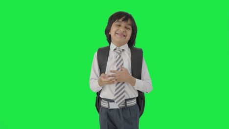 Happy-Indian-school-boy-laughing-on-someone-Green-screen