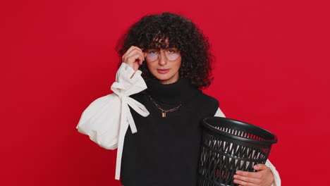 Woman-taking-off,-throwing-out-glasses-into-bin-after-medical-vision-laser-treatment-therapy-surgery