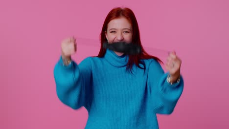 Young-smiling-woman-happily-taking-off-medical-mask-and-throws-it-away-celebrating-Coronavirus-end