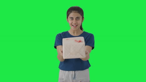 Happy-Indian-teenage-giving-a-gift-Green-screen
