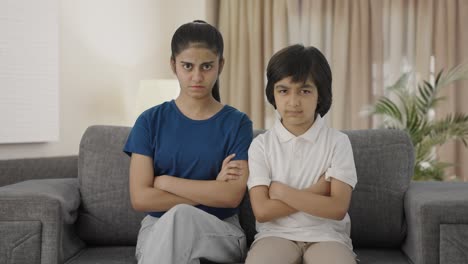 Angry-Indian-siblings-looking-at-the-camera