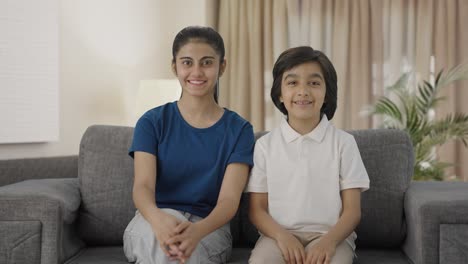 Indian-siblings-smiling-to-the-camera