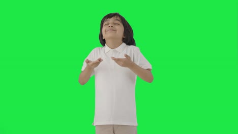 Indian-boy-doing-breathe-in-breathe-out-exercise-Green-screen