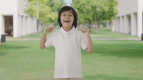 Happy-Indian-boy-dancing-and-enjoying-in-park