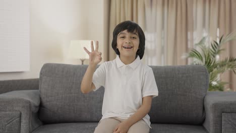 Happy-Indian-boy-showing-okay-sign