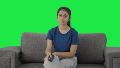 Indian-teenage-girl-watching-TV-Green-screen