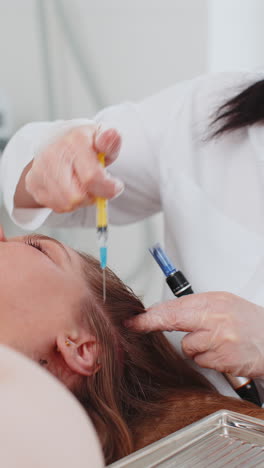 Trichologist-doing-woman-hair-regeneration-procedure,-dermapen-microneedling,-vitamin-injections