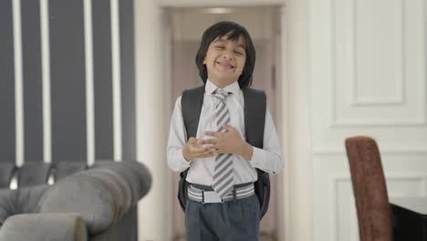 Happy-Indian-school-boy-laughing-on-someone