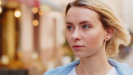 Close-up-portrait-of-happy-young-satisfied-woman-face-smiling-friendly-open-eyes-glad-expression