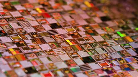 Silicon-semiconductor-wafer-close-up.-In-electronics,-a-wafer-also-called-a-slice-or-substrate-is-a-thin-slice-of-semiconductor,-a-crystalline-silicon,-used-for-the-fabrication-of-integrated-circuits