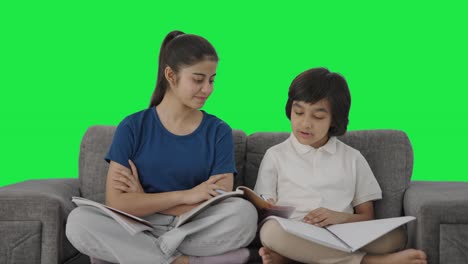 Indian-sister-helping-her-brother-in-studies-Green-screen