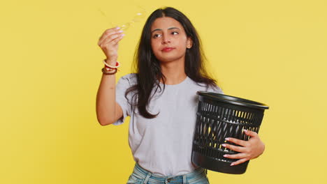 Woman-taking-off,-throwing-out-glasses-into-bin-after-medical-vision-laser-treatment-therapy-surgery