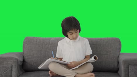 Indian-boy-reading-and-studying-Green-screen