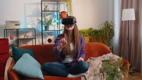 Woman-using-virtual-reality-futuristic-technology-headset-to-play-simulation-3D-video-game-at-home