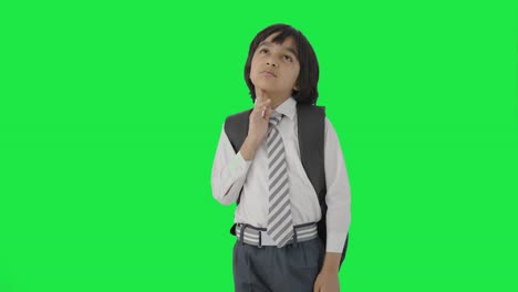 Confused-Indian-school-boy-thinking-Green-screen