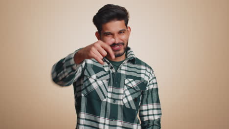 Bearded-indian-man-looking-at-camera-doing-phone-gesture-like-says-hey-you-call-me-back-conversation