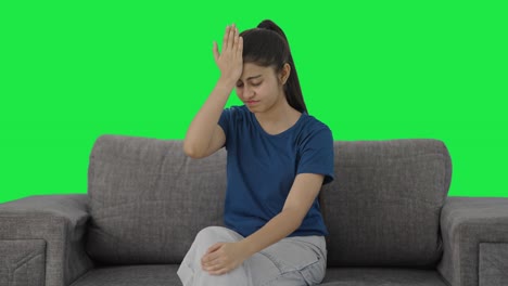 Frustrated-Indian-teenage-girl-slapping-her-head-Green-screen