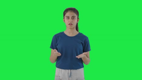 Serious-Indian-teenage-girl-talking-to-the-camera-Green-screen